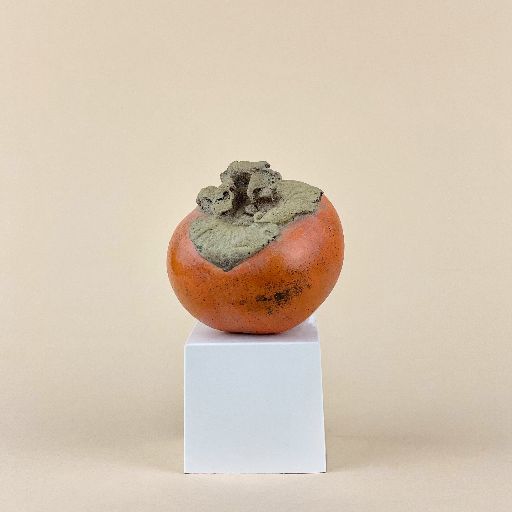 Persimmon sculpture made of plaster and hand painted 