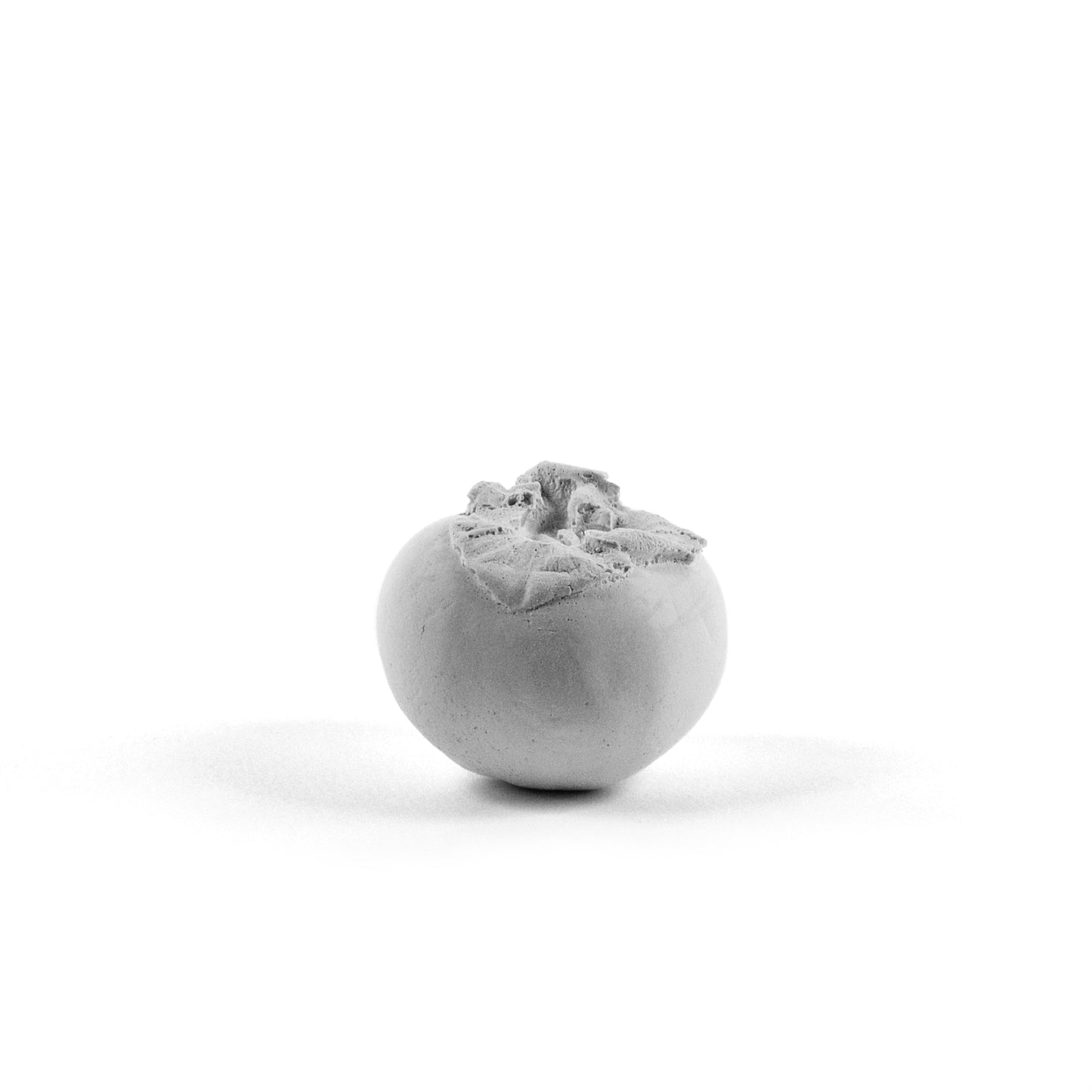 Persimmon made of plaster and fake fruit is all white for home art or wedding favors