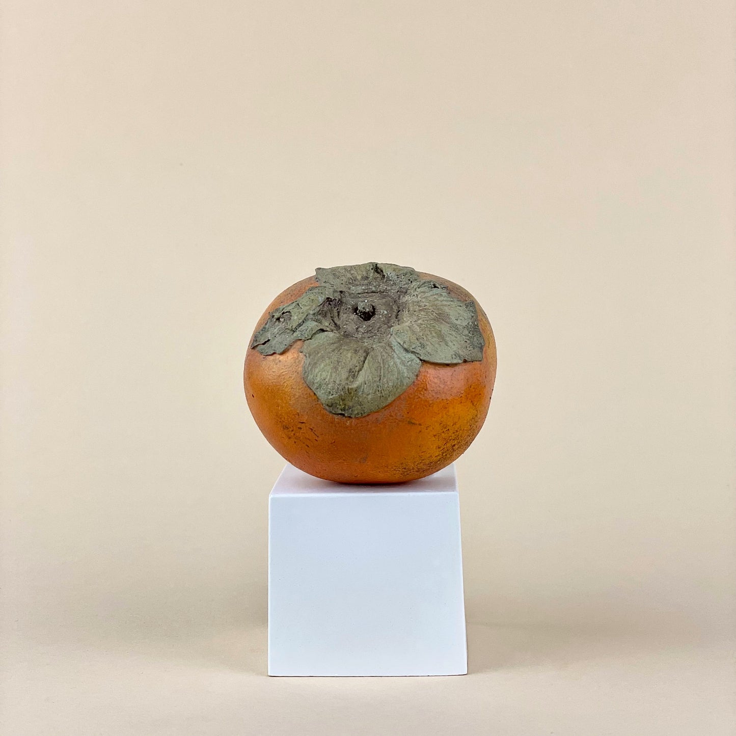 Persimmon sculpture made of plaster and hand painted