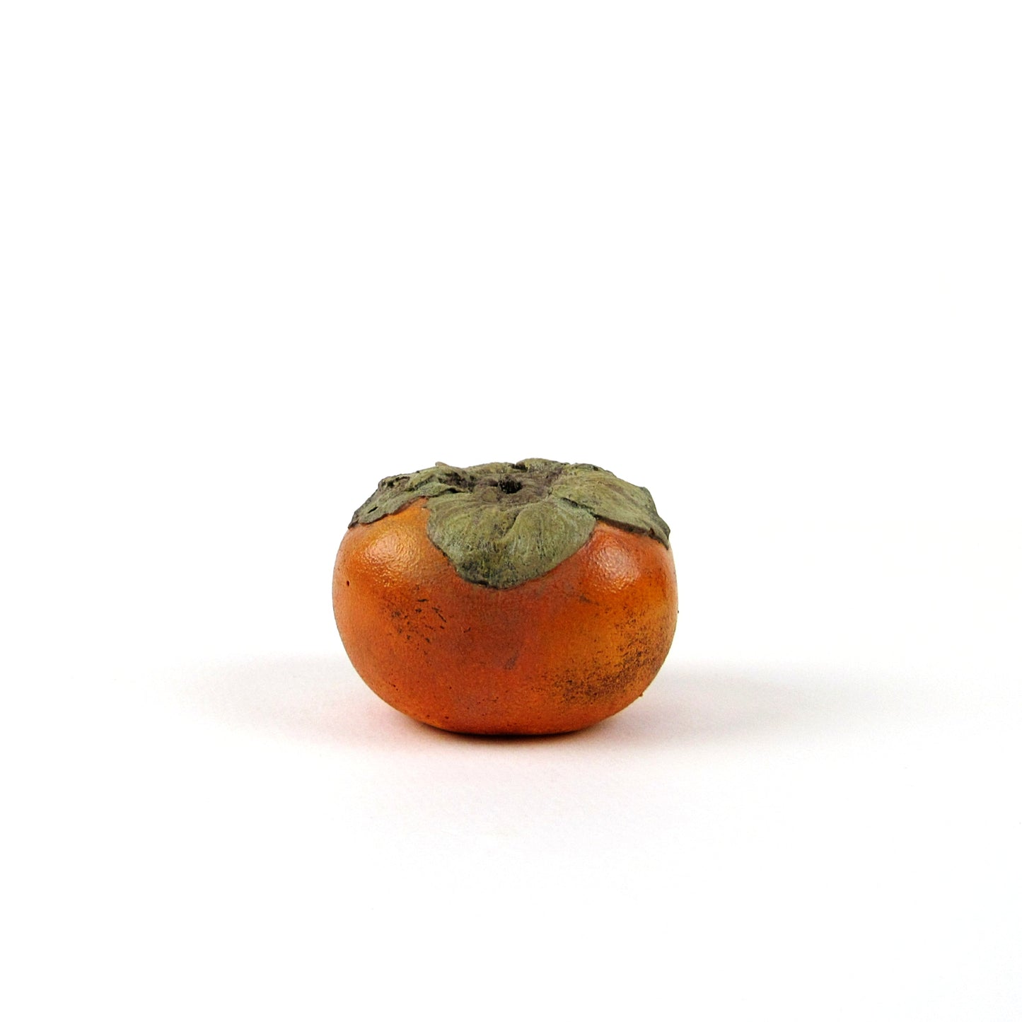 Persimmon sculpture made of plaster and hand painted